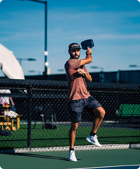 Player mid-swing against blue sky background